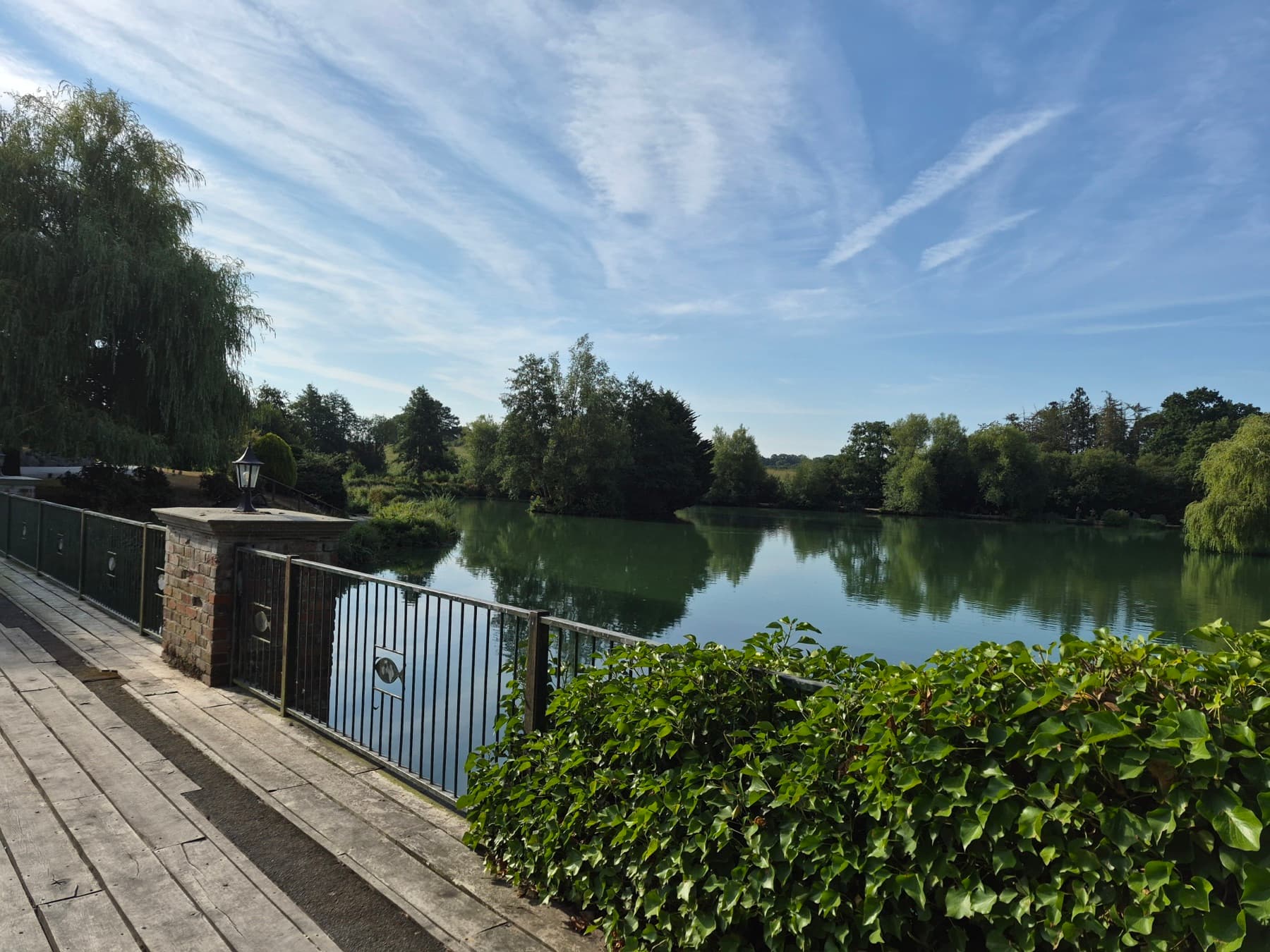 The wooden decking along the water's edge, looking out over the lake